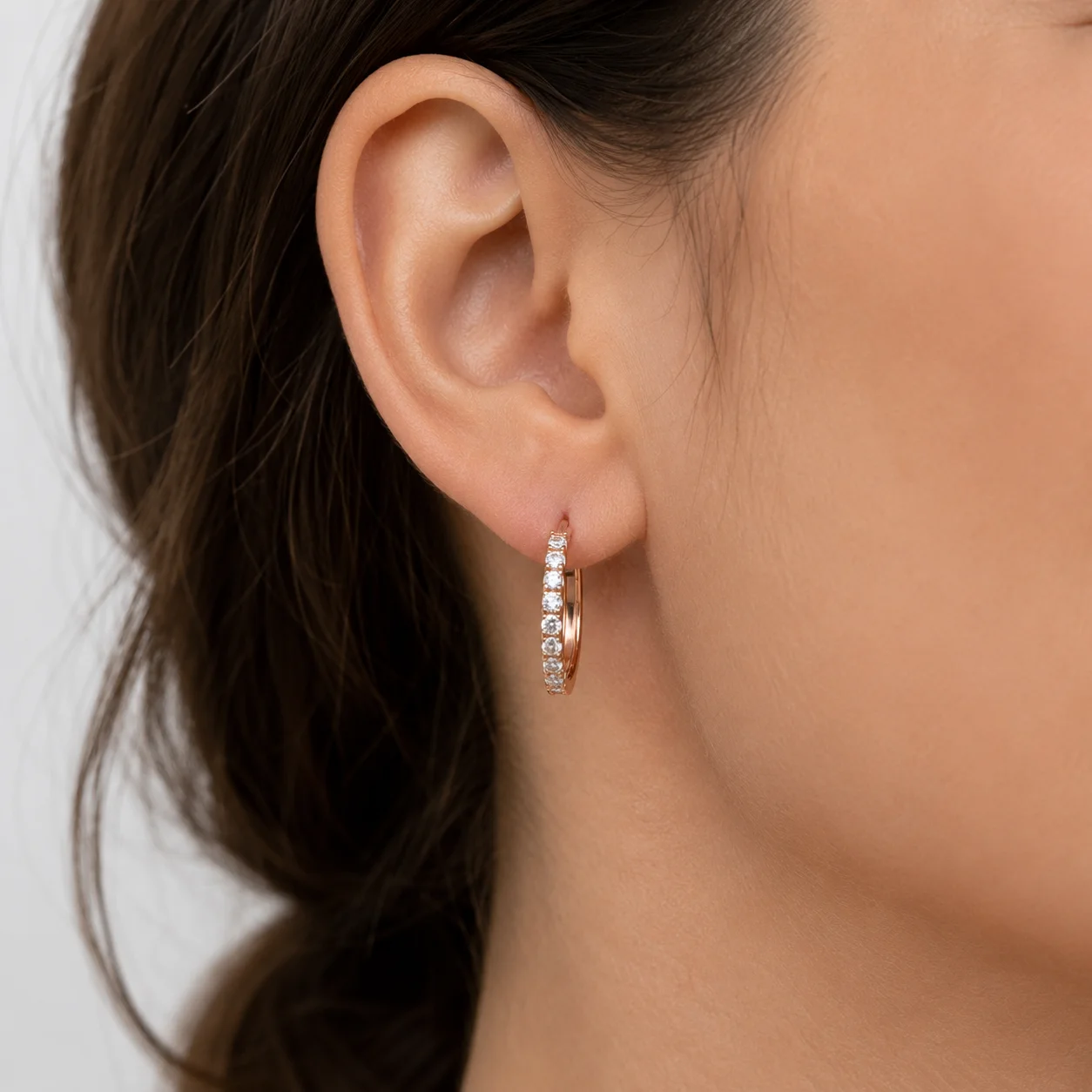 Diamond hoop earrings worn
